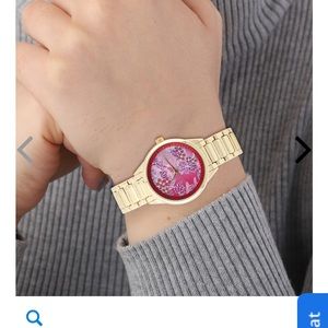 Strata Japanese Movement Watch with Red Background Flower Pattern Dial.